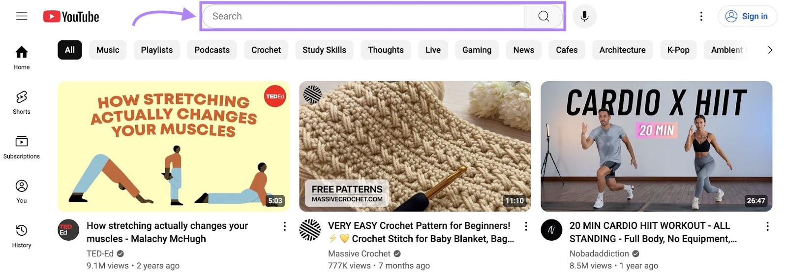 The YouTube home page with the search bar on top highlighted.